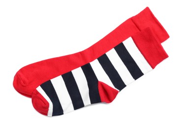 Photo of Different colorful socks on white background, top view