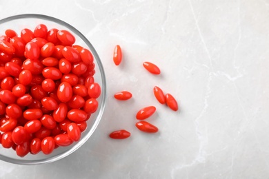 Fresh ripe goji berries on marble table, flat lay. Space for text