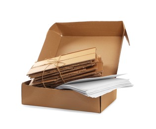Cardboard box with waste paper isolated on white