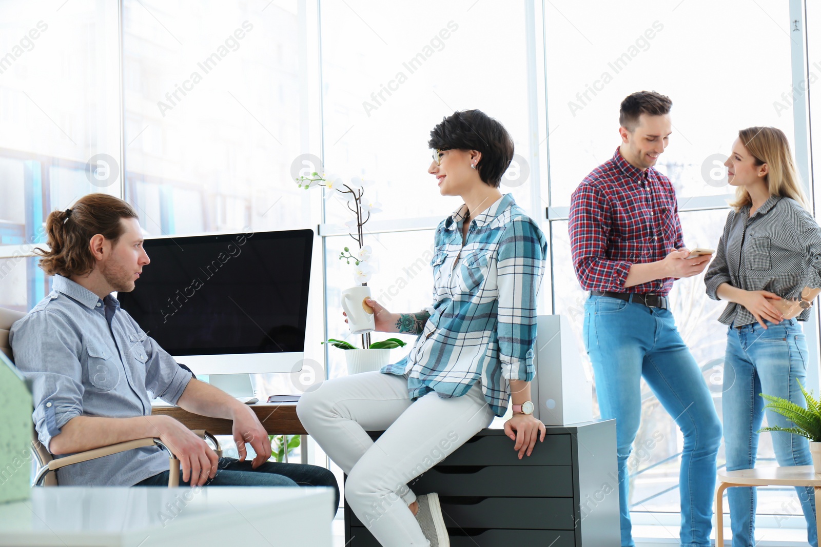 Photo of Young people having business training in office