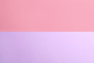 Photo of Violet and pink paper sheets as colorful background, top view