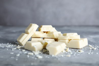 Photo of Delicious white chocolate on light grey table