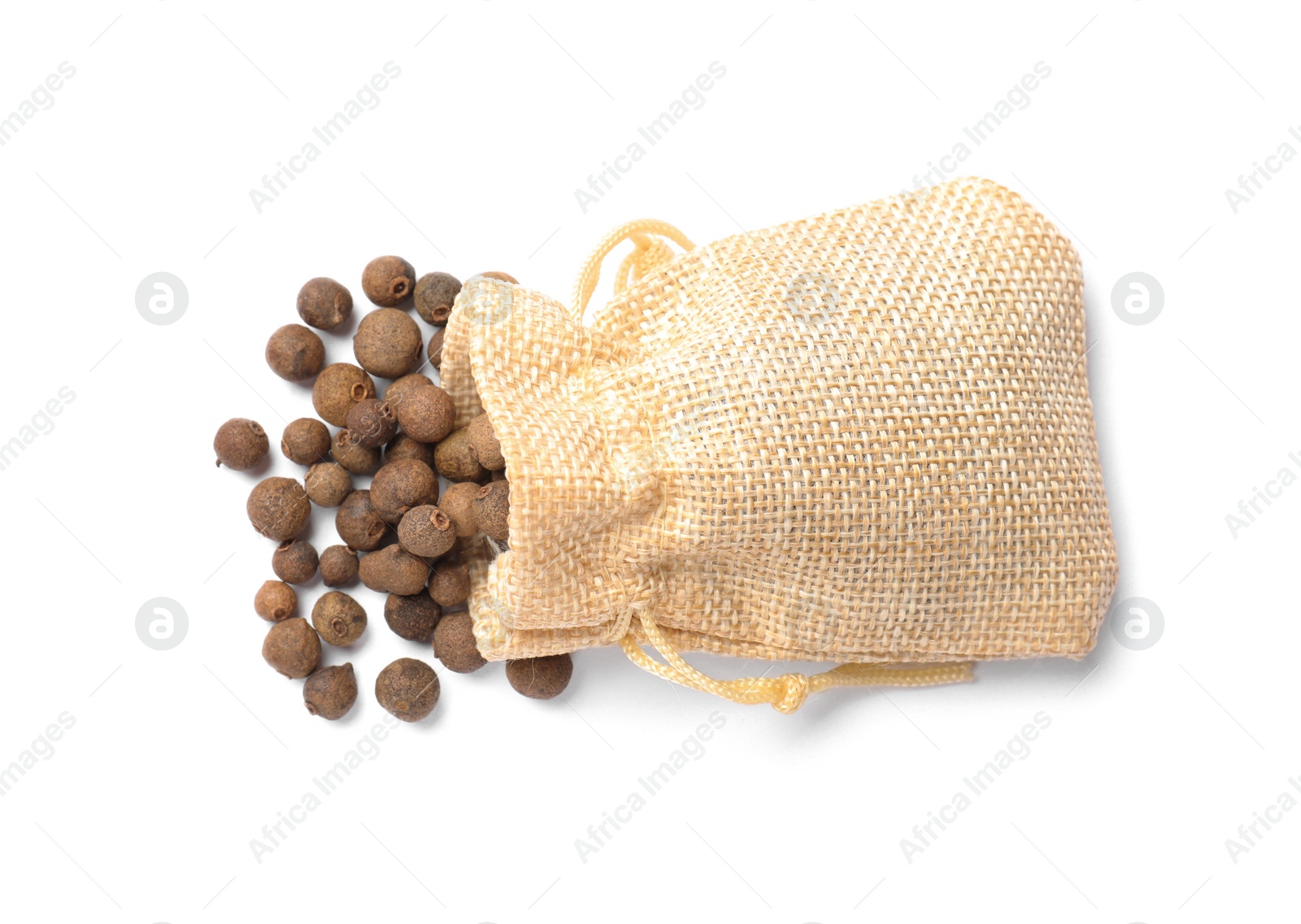 Photo of Dry allspice berries (Jamaica pepper) in bag isolated on white, top view