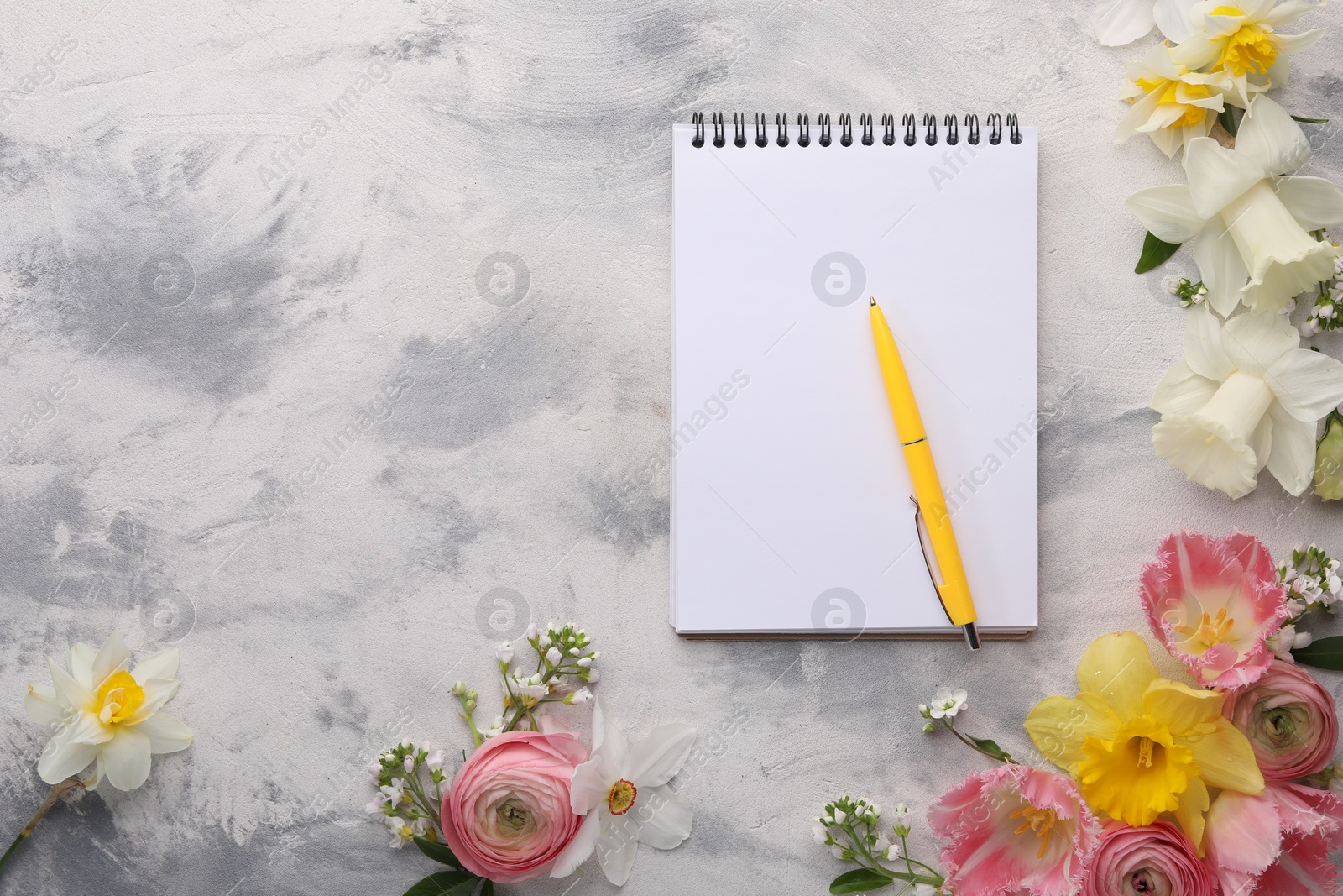 Photo of Guest list. Notebook, pen and beautiful flowers on gray textured background, flat lay. Space for text