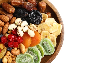 Different dried fruits and nuts in bowl on white background, closeup. Space for text