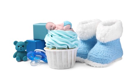 Photo of Beautifully decorated baby shower cupcake for boy, toys and booties on white background