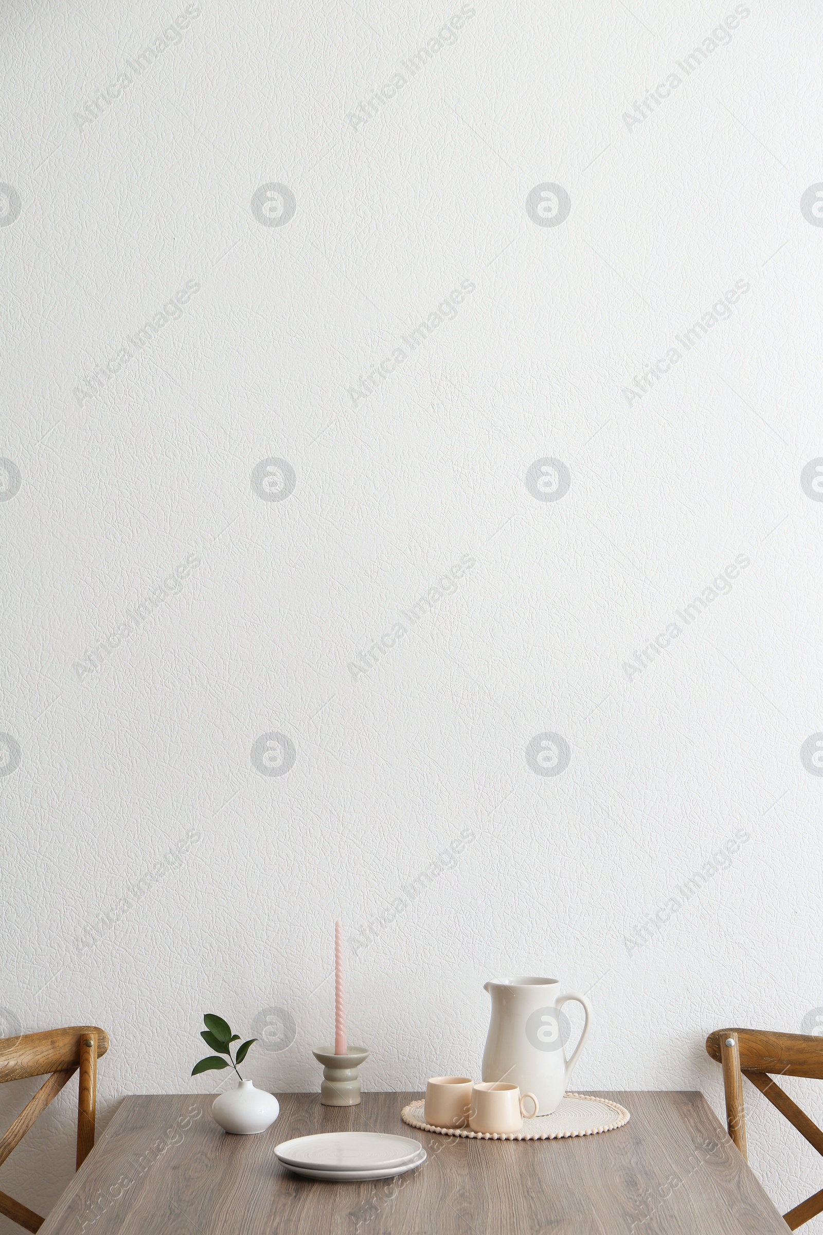 Photo of Room interior with dining table and wooden chairs