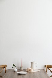 Room interior with dining table and wooden chairs