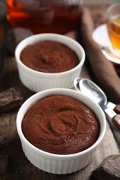 Photo of Delicious fresh chocolate fondant on wooden board