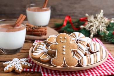 Photo of Delicious gingerbread Christmas cookies on table, closeup