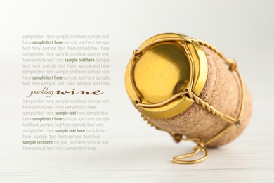 Image of Sparkling wine cork with muselet cap on white background. Space for design