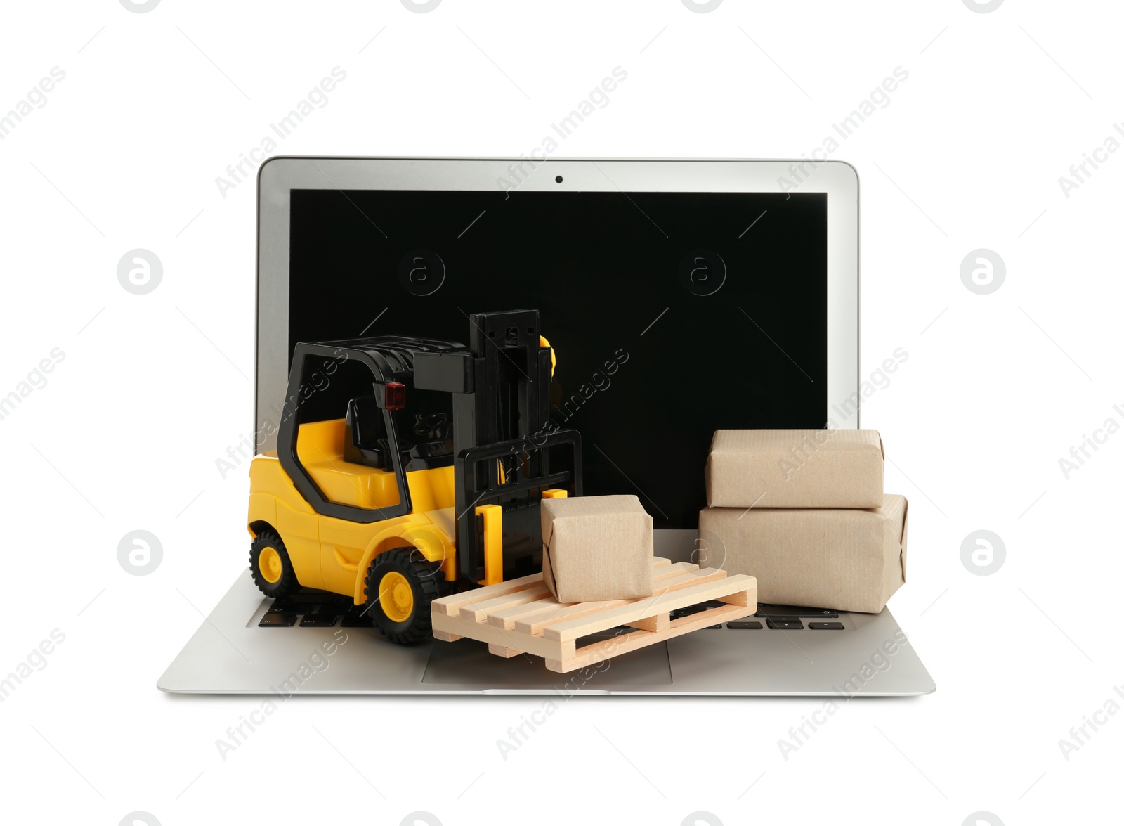 Photo of Laptop, toy forklift with wooden pallet and boxes on white background