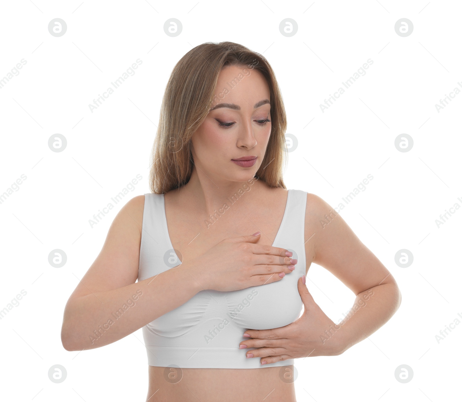 Photo of Mammology. Young woman doing breast self-examination on white background