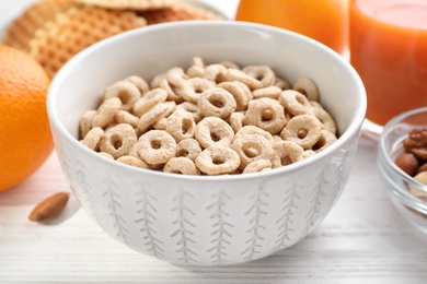 Corn rings on white wooden table, closeup. Healthy breakfast