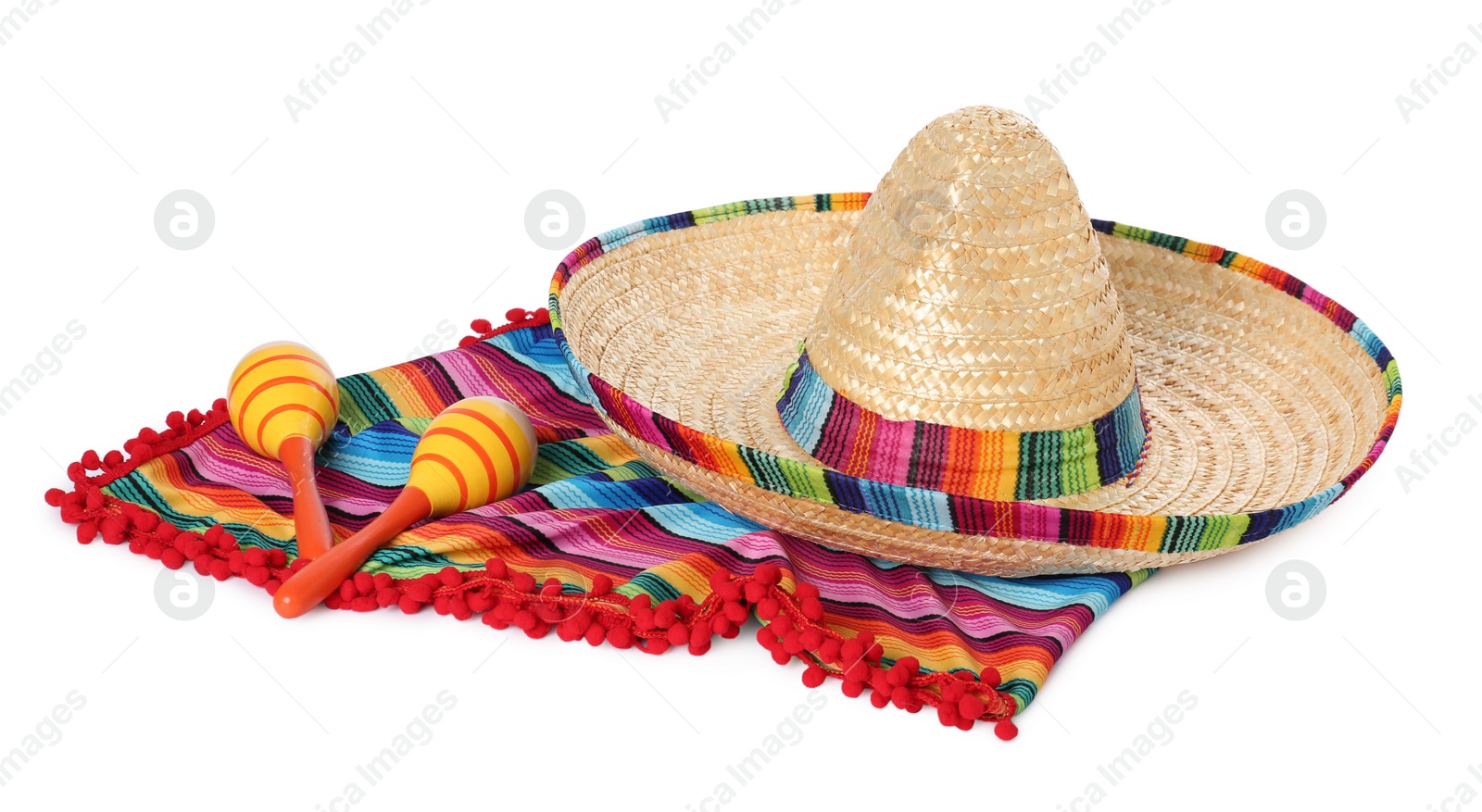 Photo of Mexican sombrero hat, maracas and colorful poncho isolated on white