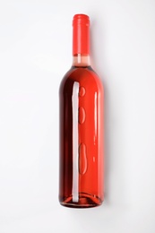 Bottle of delicious wine on white background