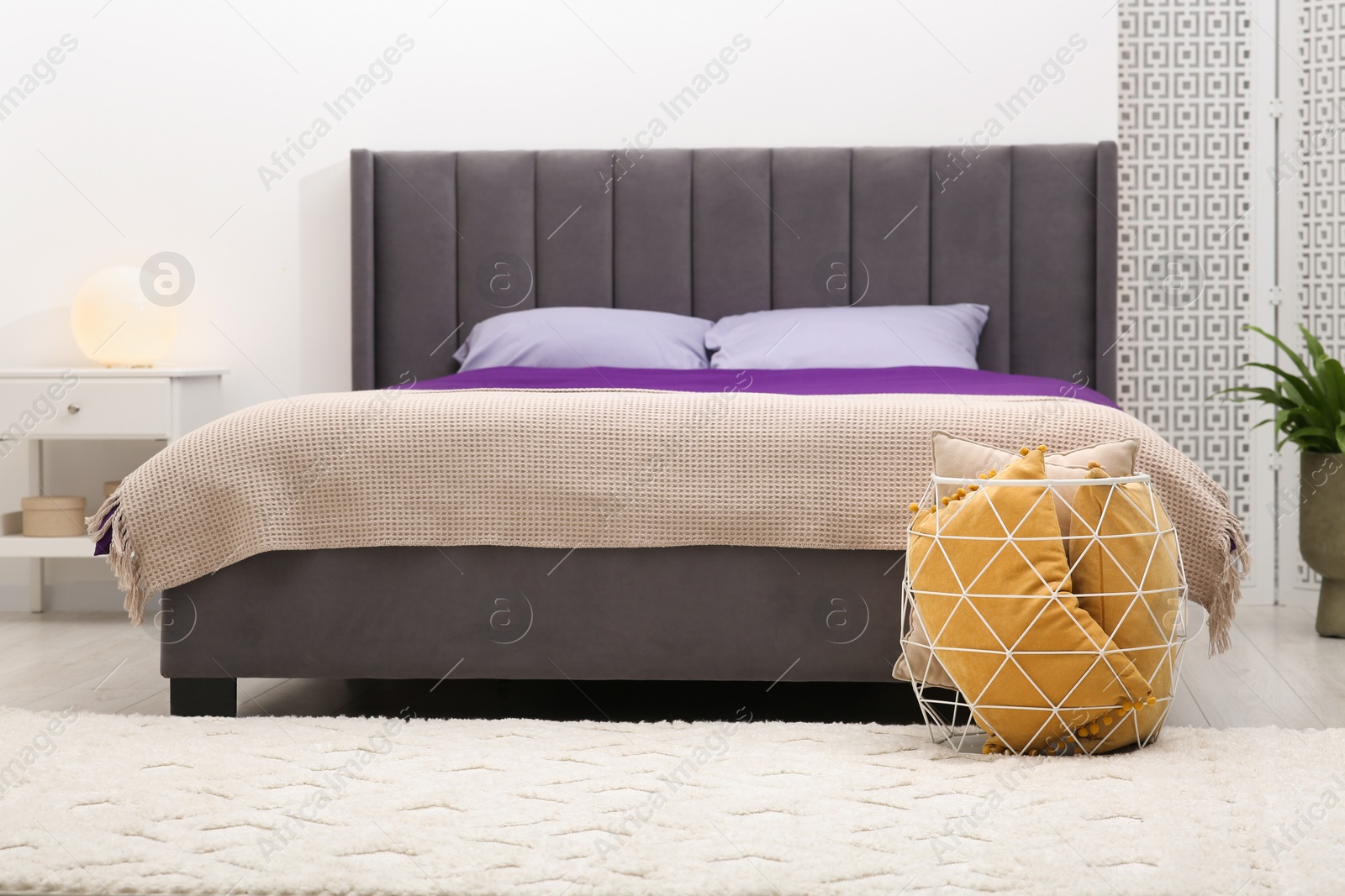 Photo of Comfortable bed and pillows in bedroom. Interior design