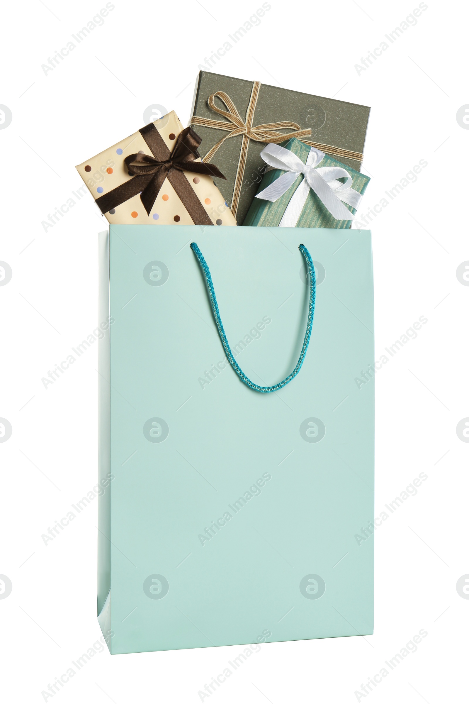 Photo of Paper shopping bag full of gift boxes isolated on white