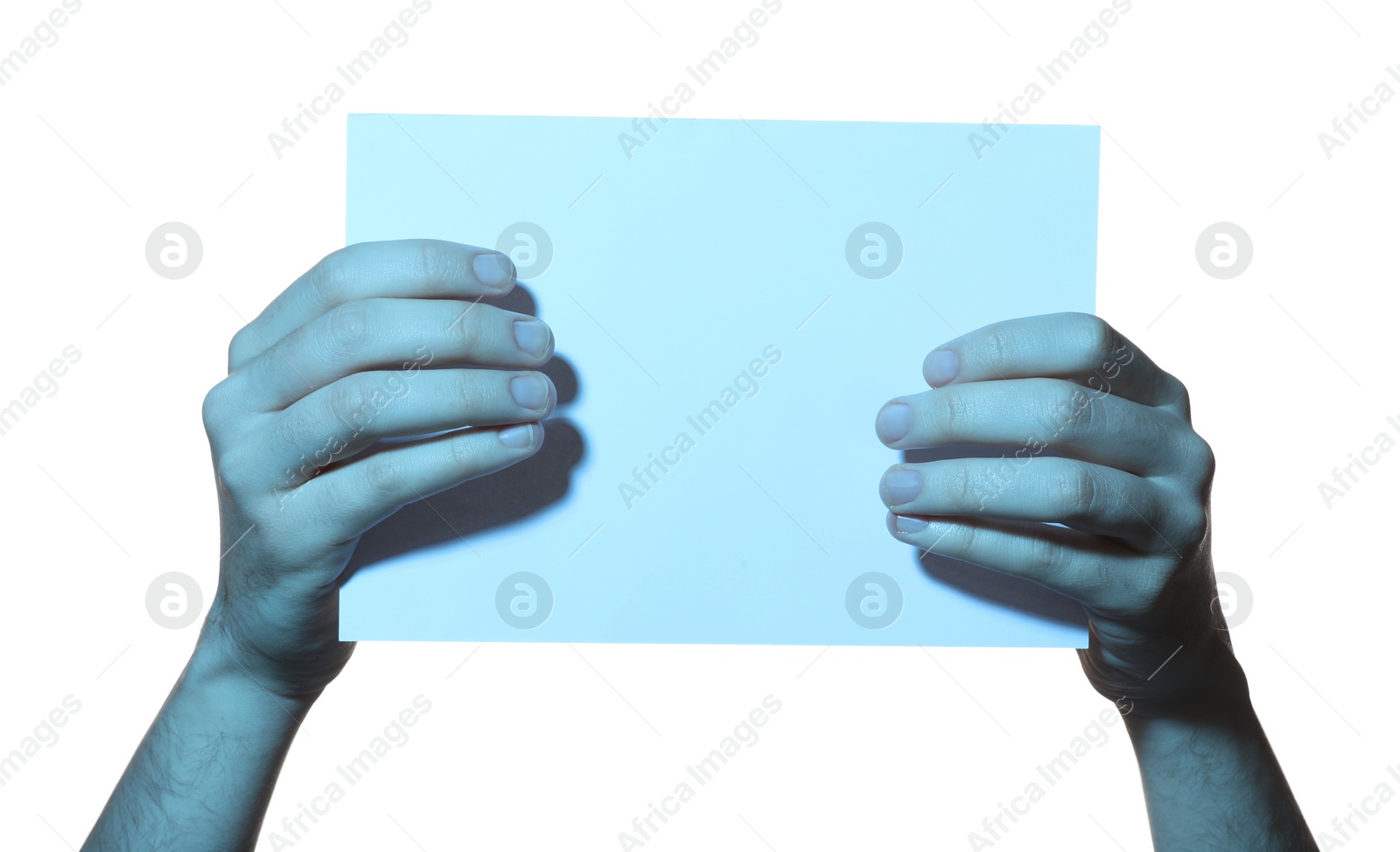 Photo of Man holding sheet of paper on white background, closeup and space for text. Color tone effect