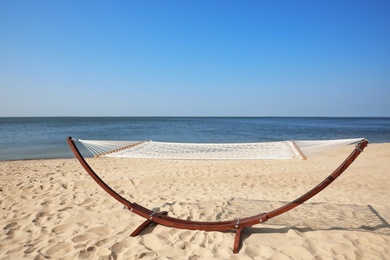 Photo of Empty hammock at seaside. Time to relax