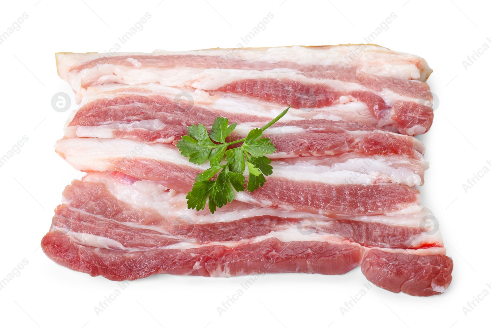 Photo of Pieces of raw pork belly and parsley isolated on white