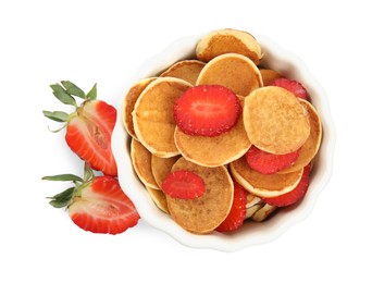 Photo of Delicious mini pancakes cereal with strawberries on white background, top view