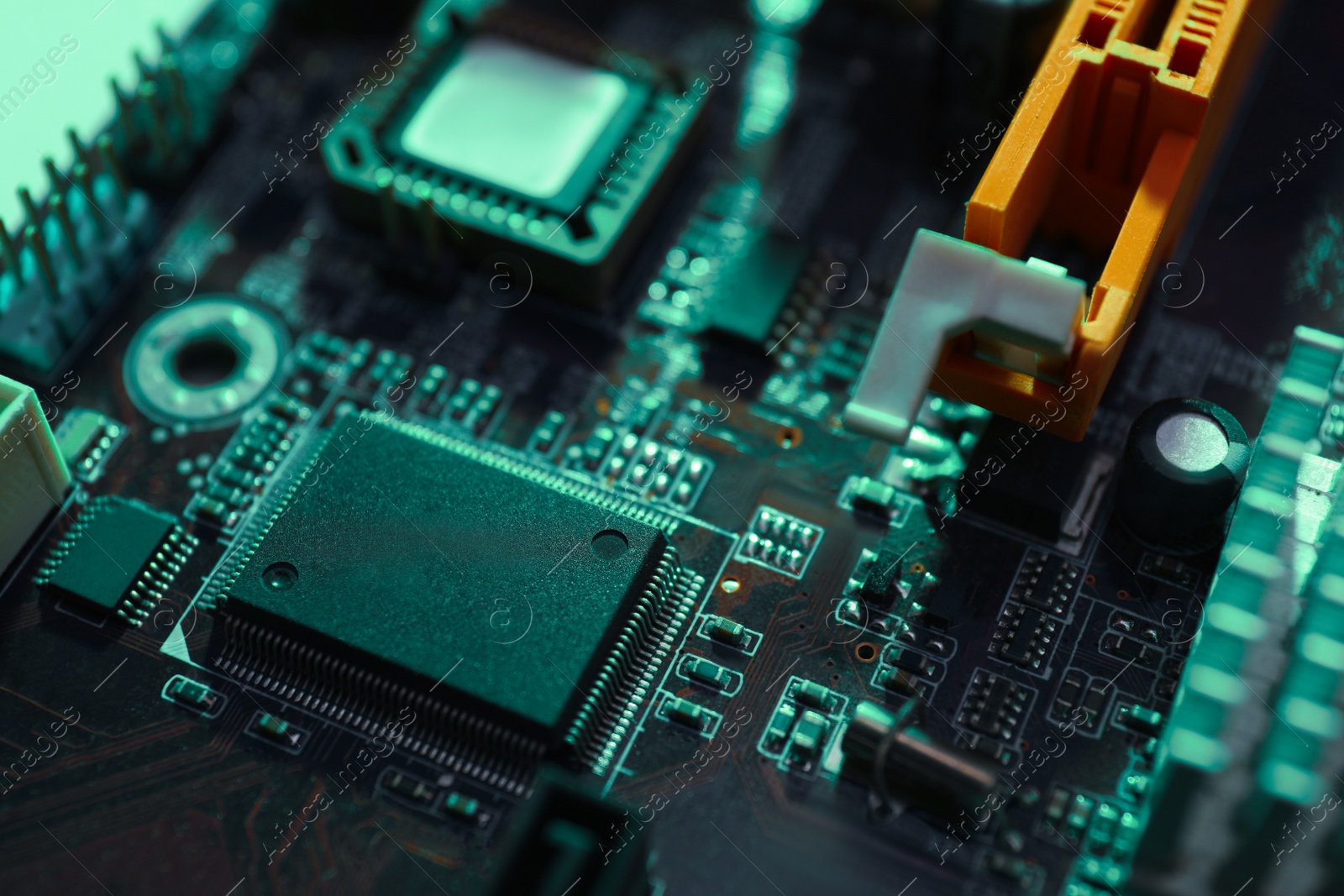 Photo of Computer motherboard as background, closeup. Electronic device