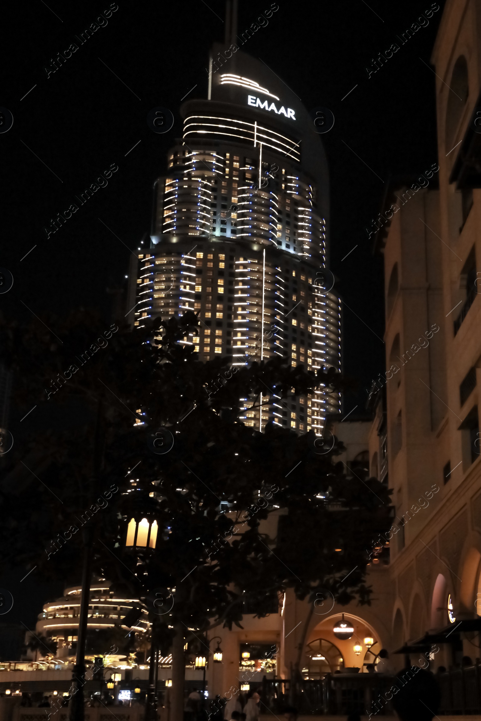 Photo of DUBAI, UNITED ARAB EMIRATES - NOVEMBER 04, 2018: Night cityscape with Address Downtown building