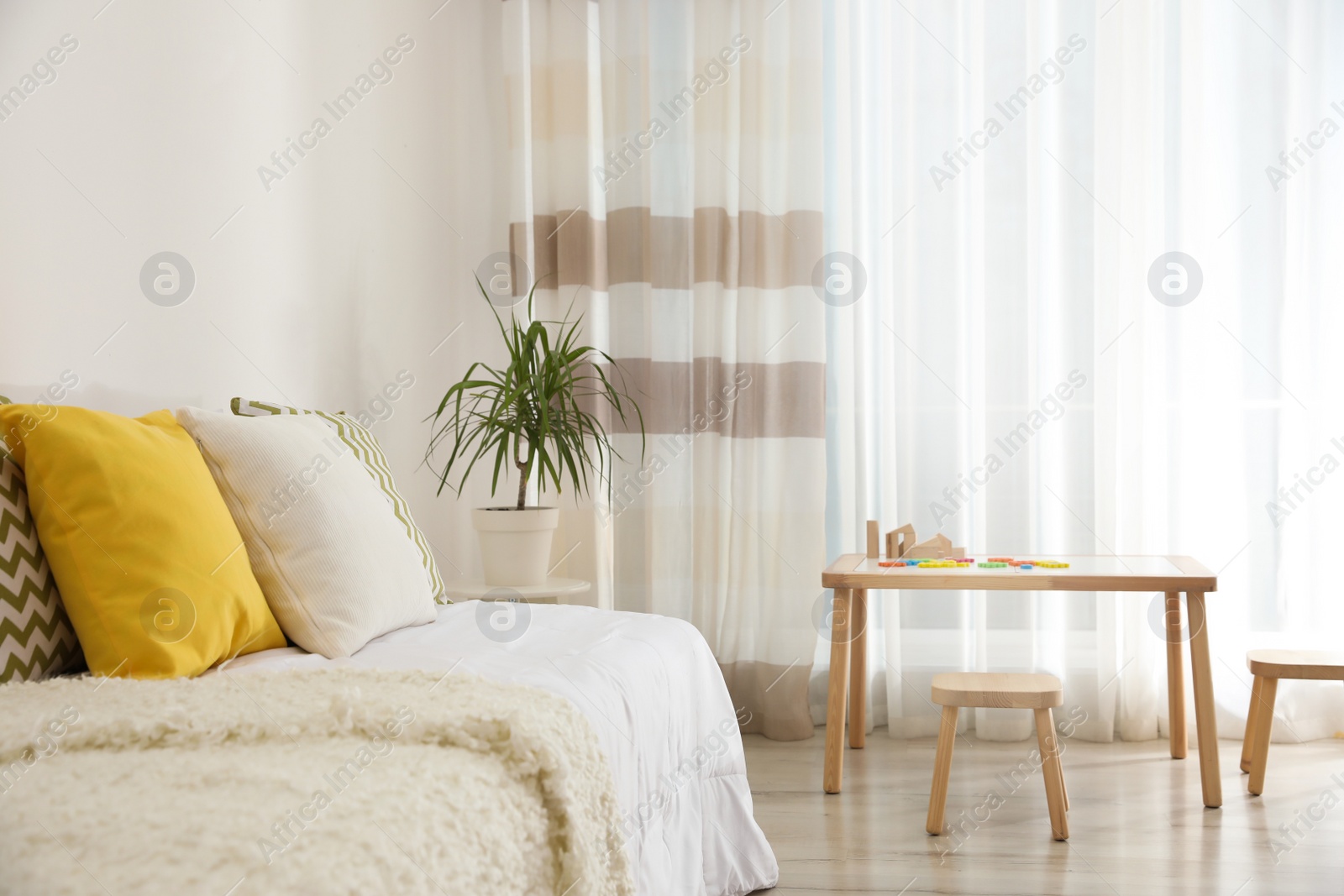 Photo of Modern child room interior with comfortable bed