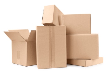 Photo of Pile of cardboard boxes on white background