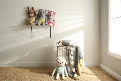 Photo of Many cute toys indoors. Baby room interior elements