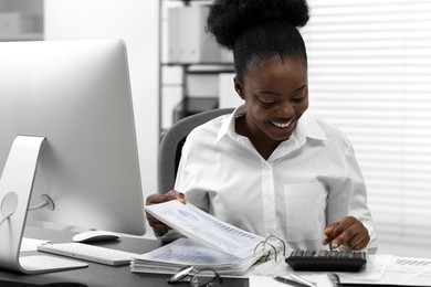 Professional accountant working at desk in office