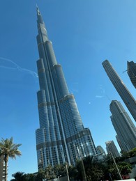 Dubai, United Arab Emirates - May 2, 2023: Beautiful view of Burj Khalifa in city under blue sky