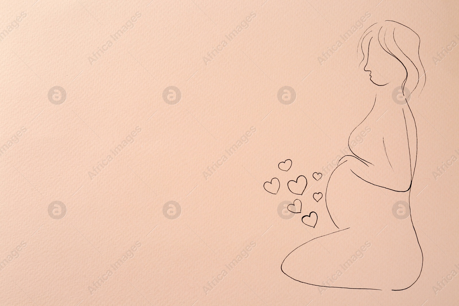 Photo of Pregnant woman figure drawn on pale pink background, top view with space for text. Surrogacy concept