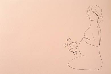 Pregnant woman figure drawn on pale pink background, top view with space for text. Surrogacy concept