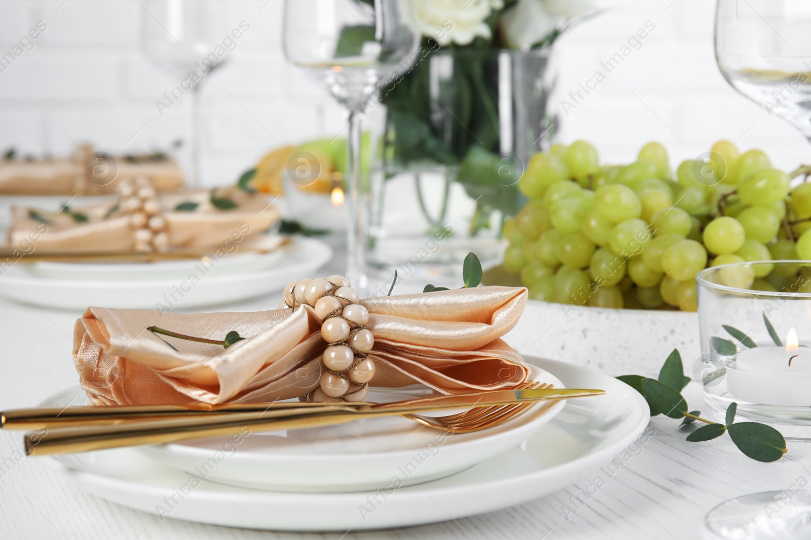 Photo of Elegant table setting with festive decoration in restaurant