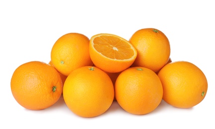 Pile of ripe oranges isolated on white