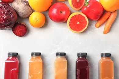 Photo of Flat lay composition with healthy detox smoothies and ingredients on light background