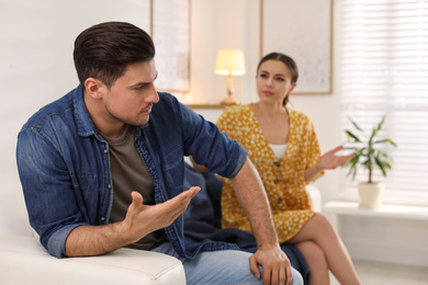 Couple quarreling due to jealousy in relationship at home