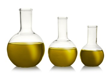 Boiling flasks with yellow liquid isolated on white. Laboratory glassware