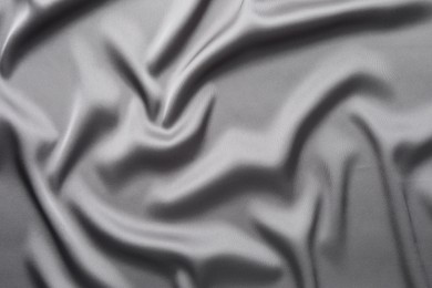 Texture of beautiful light grey silk fabric as background, closeup