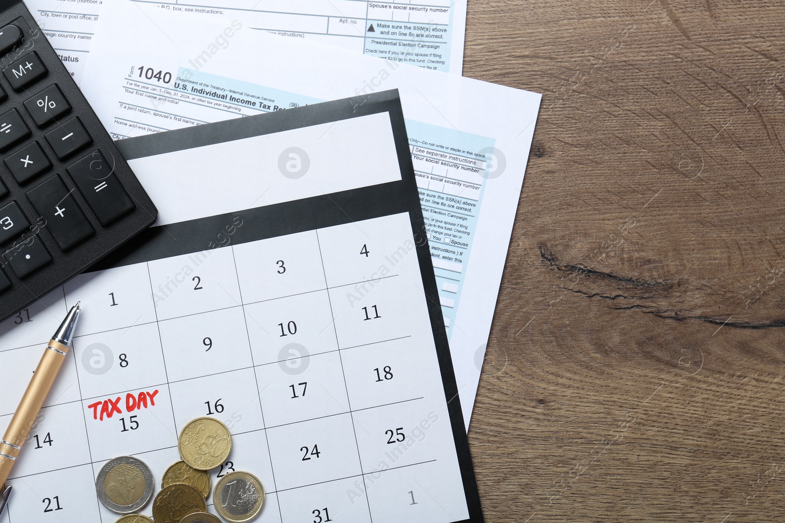 Photo of Calendar with date reminder about tax day, coins, documents and calculator on wooden table, top view. Space for text