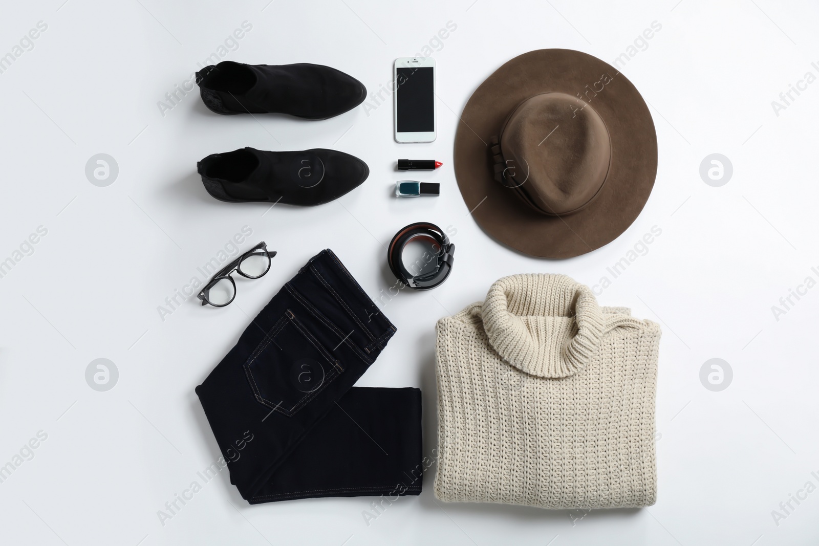 Photo of Flat lay composition with female winter clothes on white background