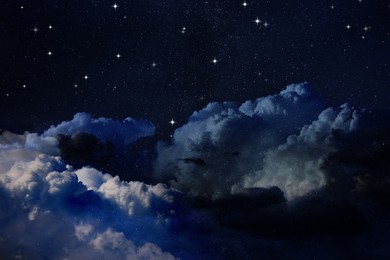 Image of Beautiful view of night sky with clouds and stars