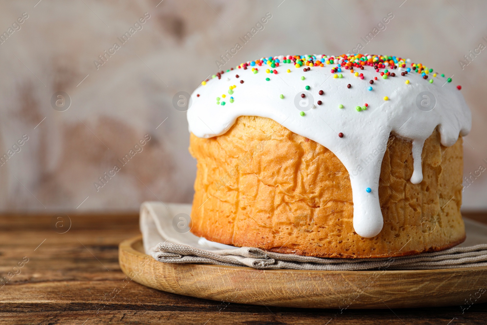 Photo of Beautiful Easter cake with icing on wooden table