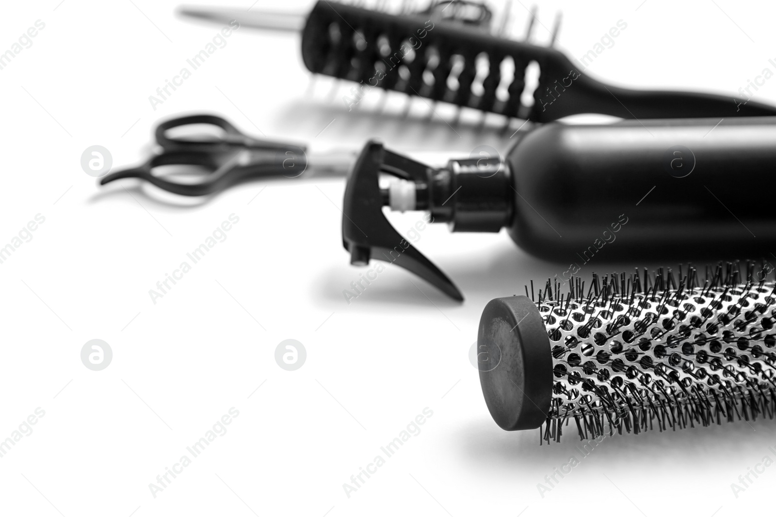 Photo of Professional hairdresser tools on white background