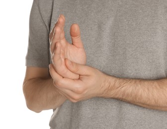 Man applying cream onto hand against white background, closeup