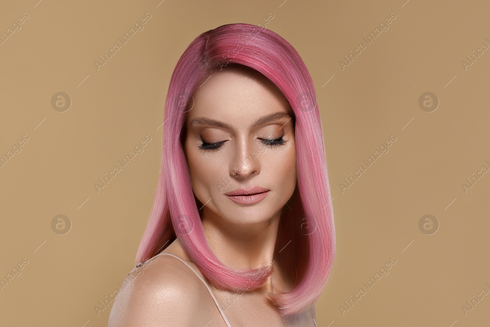 Image of Hair styling. Gorgeous woman with colorful hair on beige background