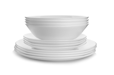 Photo of Stack of clean plates on white background