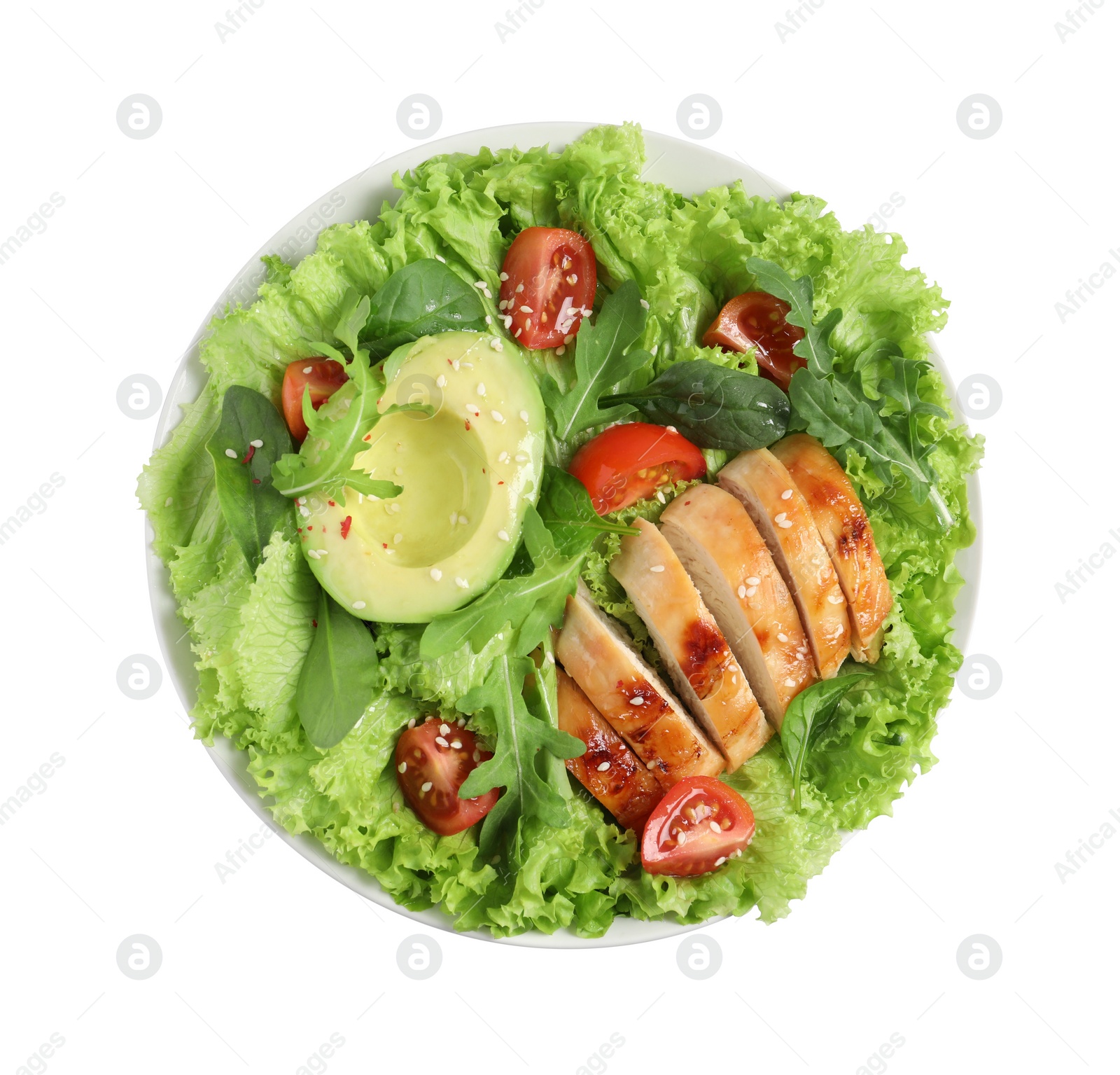 Photo of Delicious salad with chicken, cherry tomato and avocado in bowl isolated on white, top view